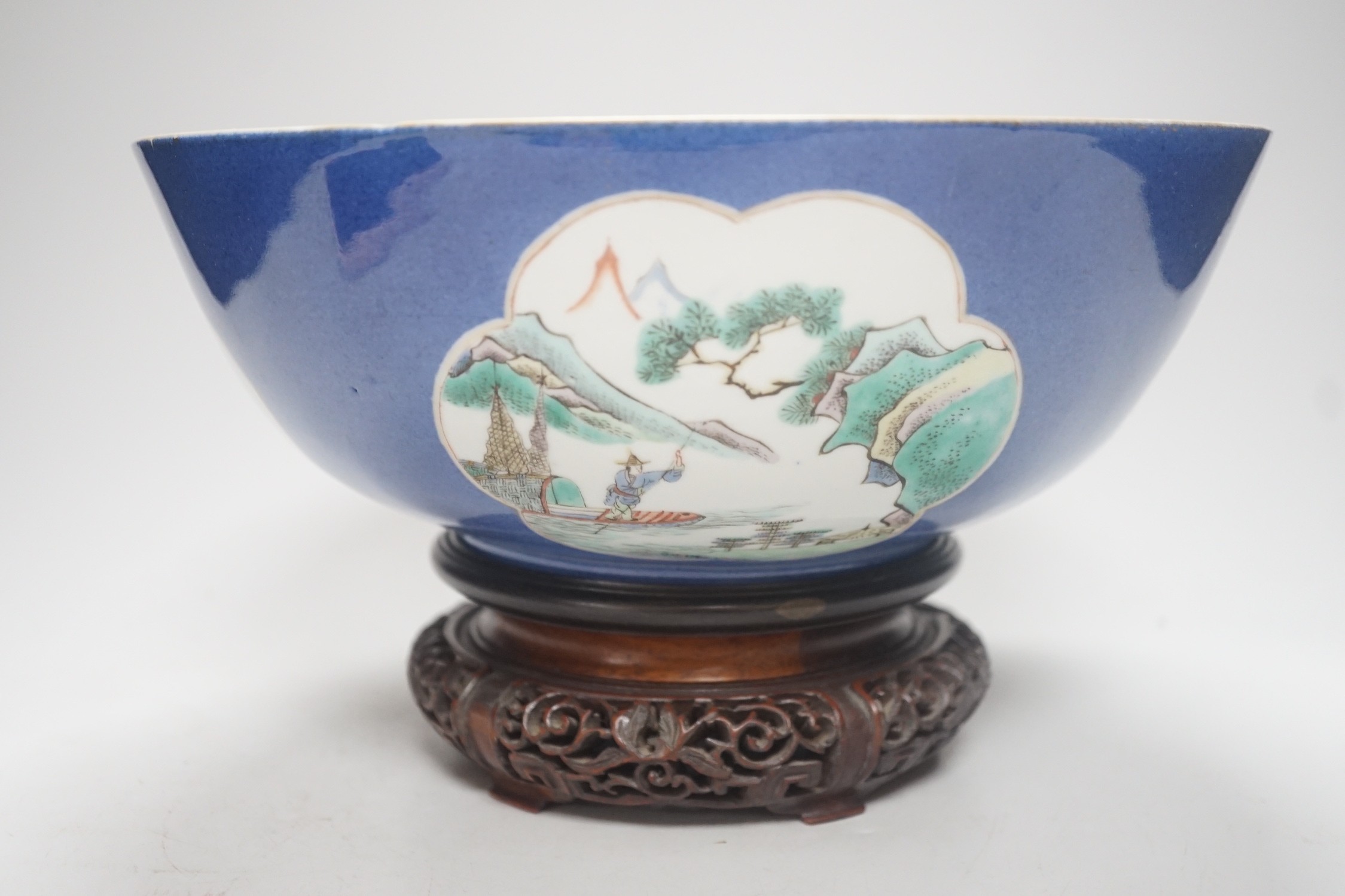 A 19th century Chinese famille verte powder blue bowl, 26cm diameter, wood stand